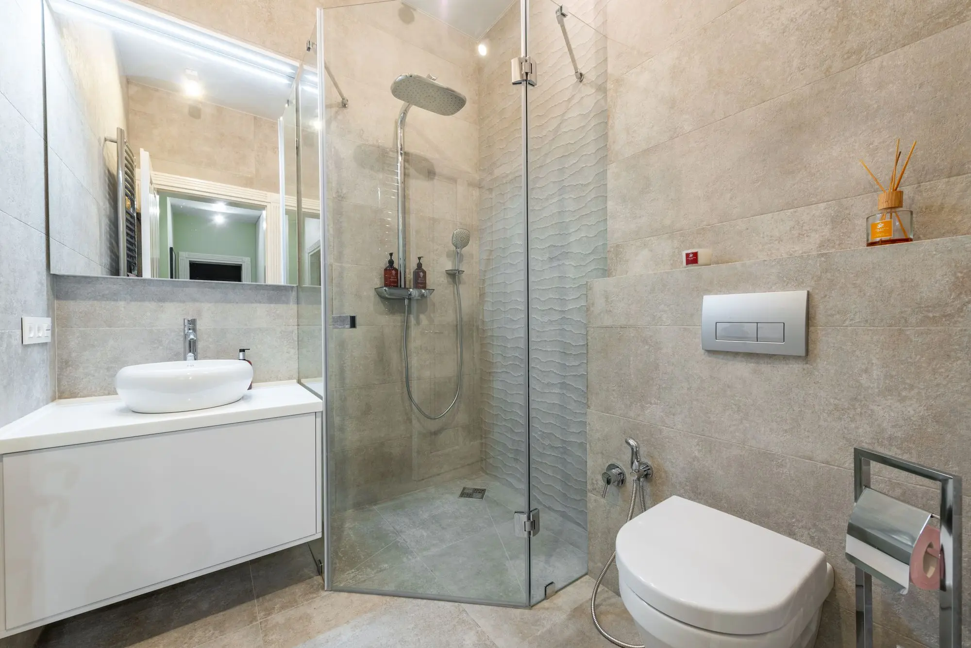 Shower room between a vanity and a toilet