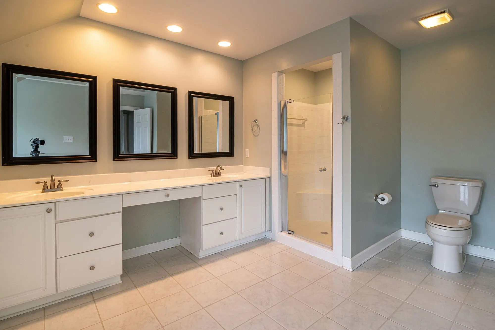 Contemporary bathroom with dual sinks and a shower panel