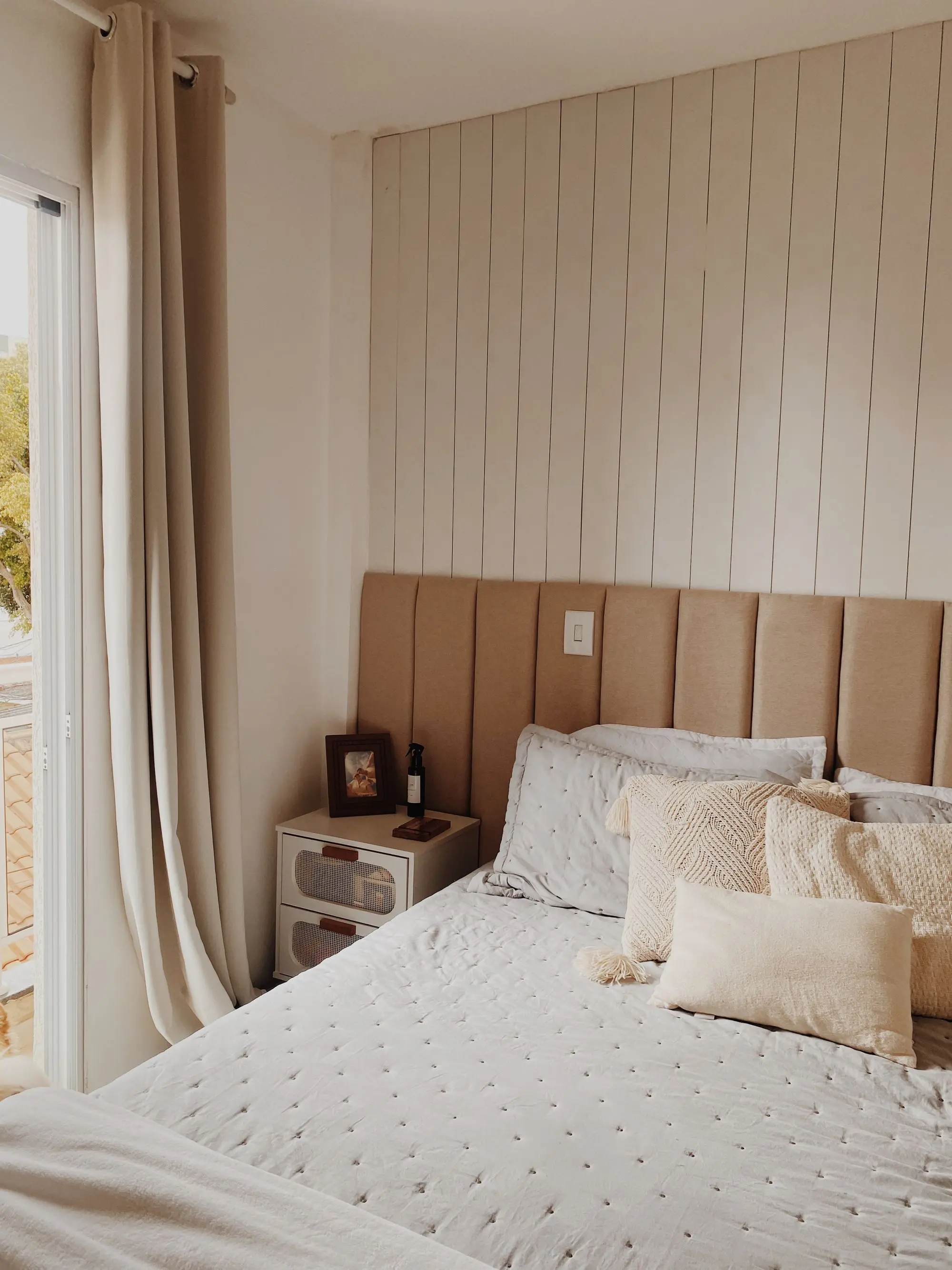 Bedroom with a beige shiplap feature wall