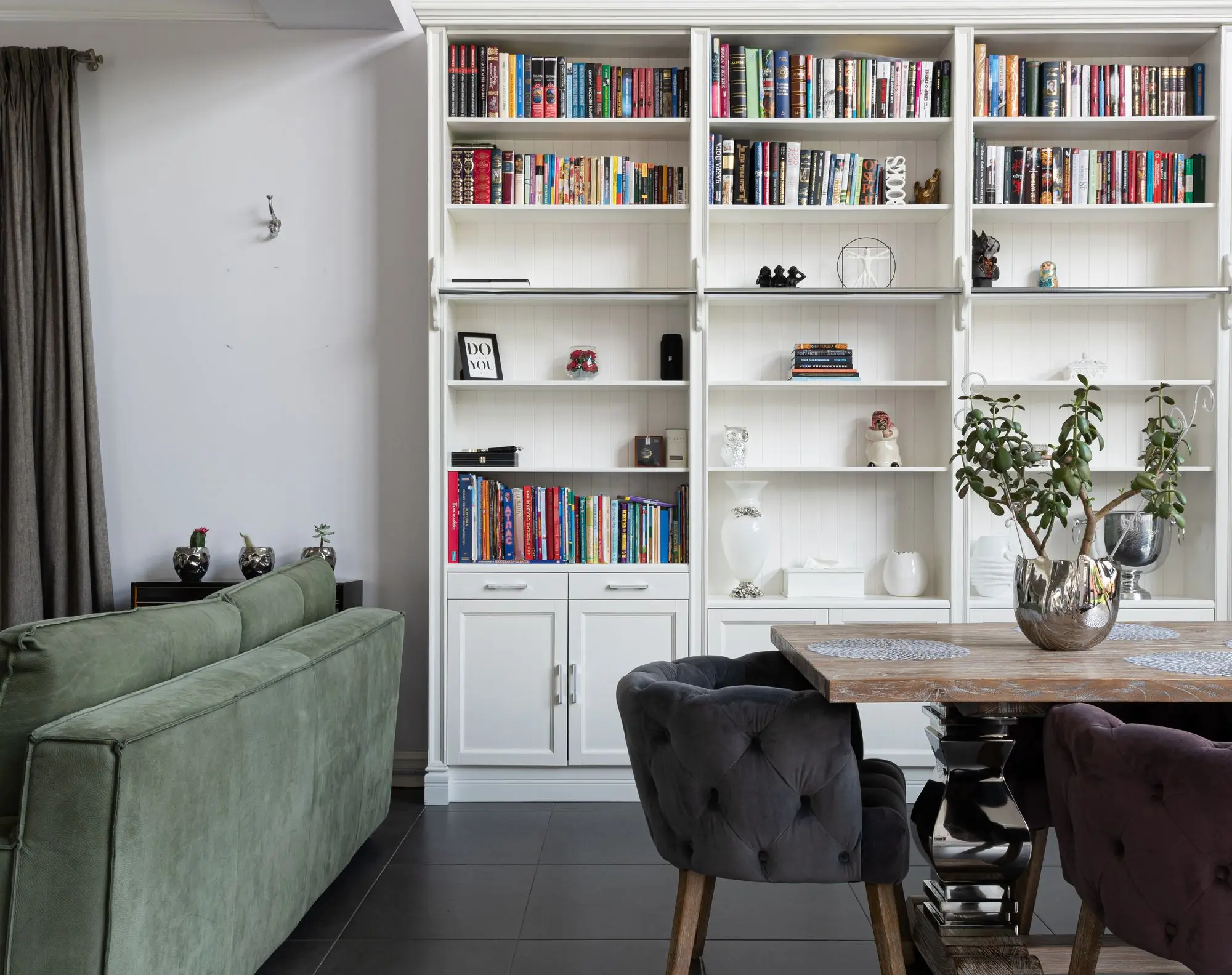 Modern living room with a full wall bookcase