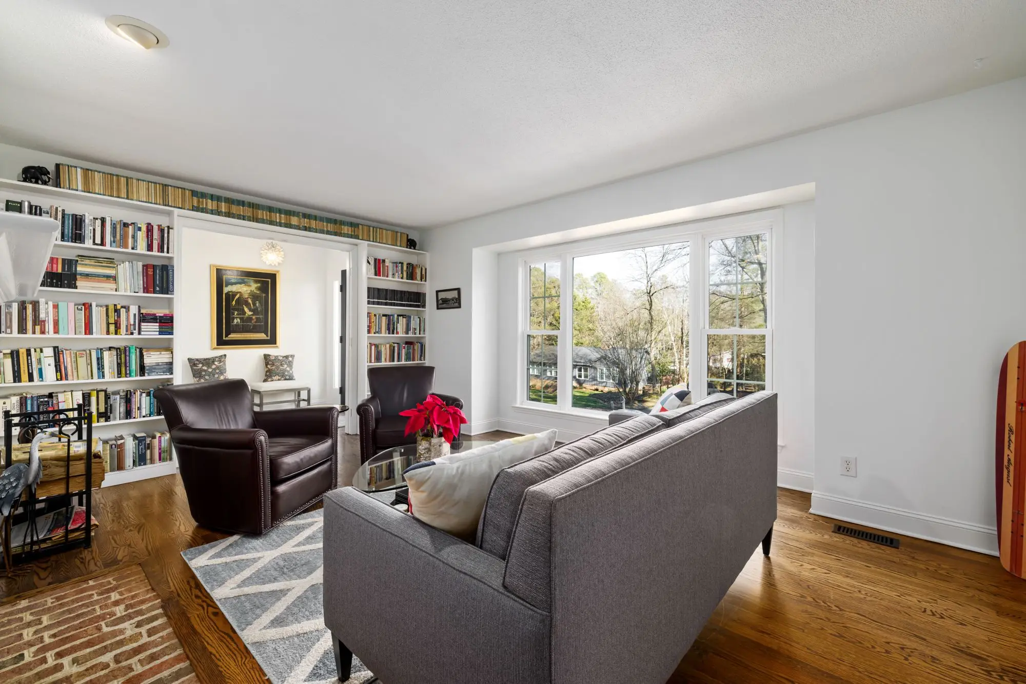 Living room with white built-in bookcases