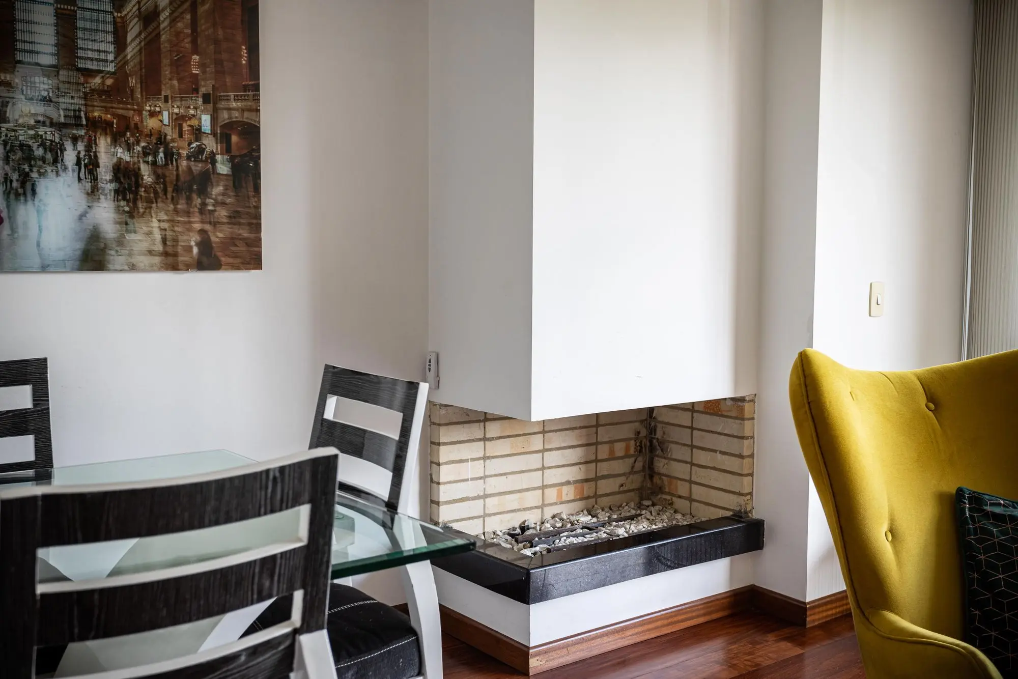 Contemporary fireplace with a tiled surround and raised hearth