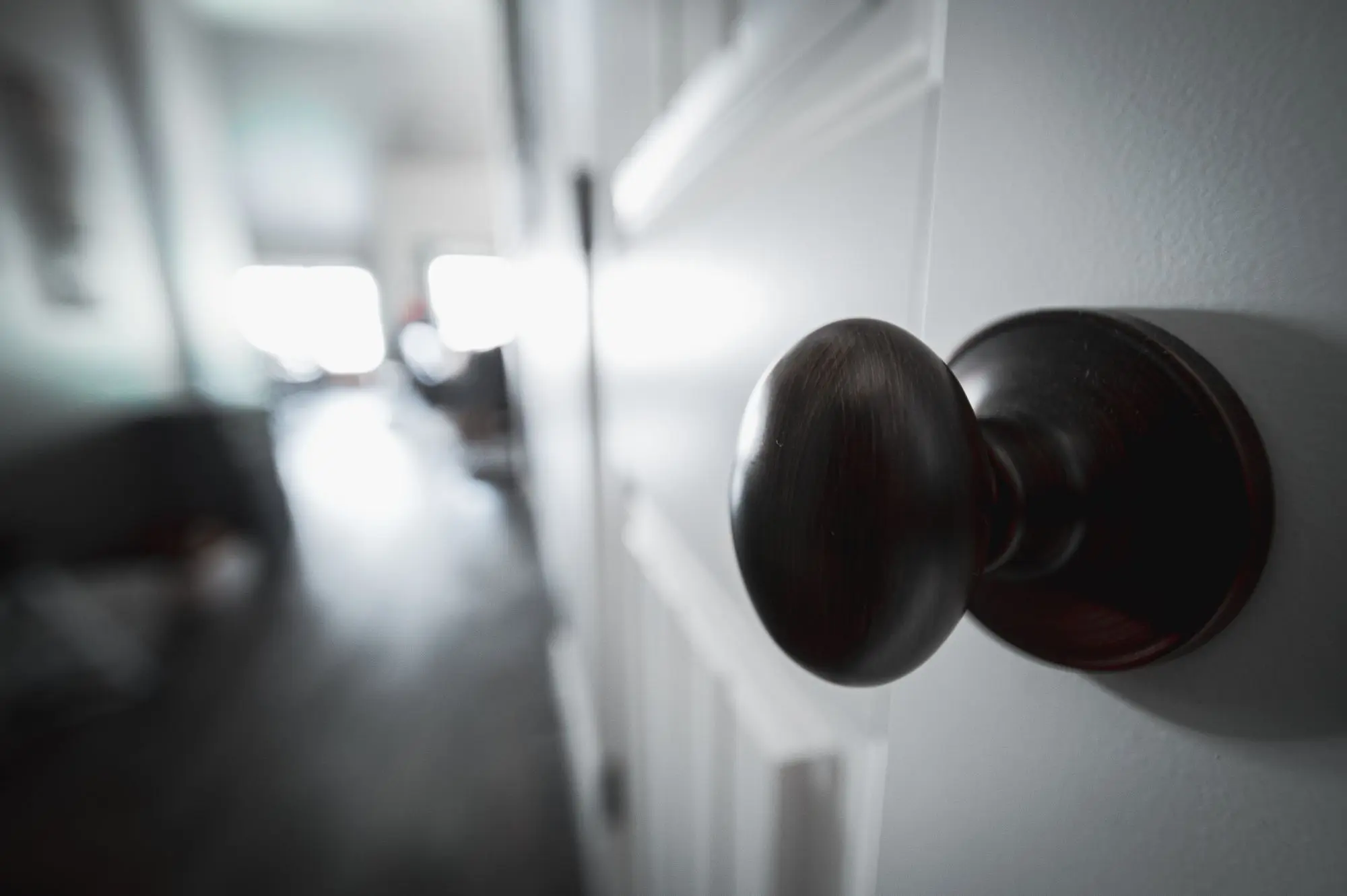 Matte black knob on a white interior door