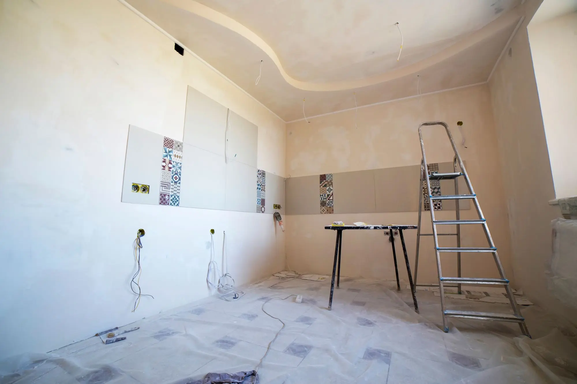 Room mid-renovation with ceiling and walls being finished