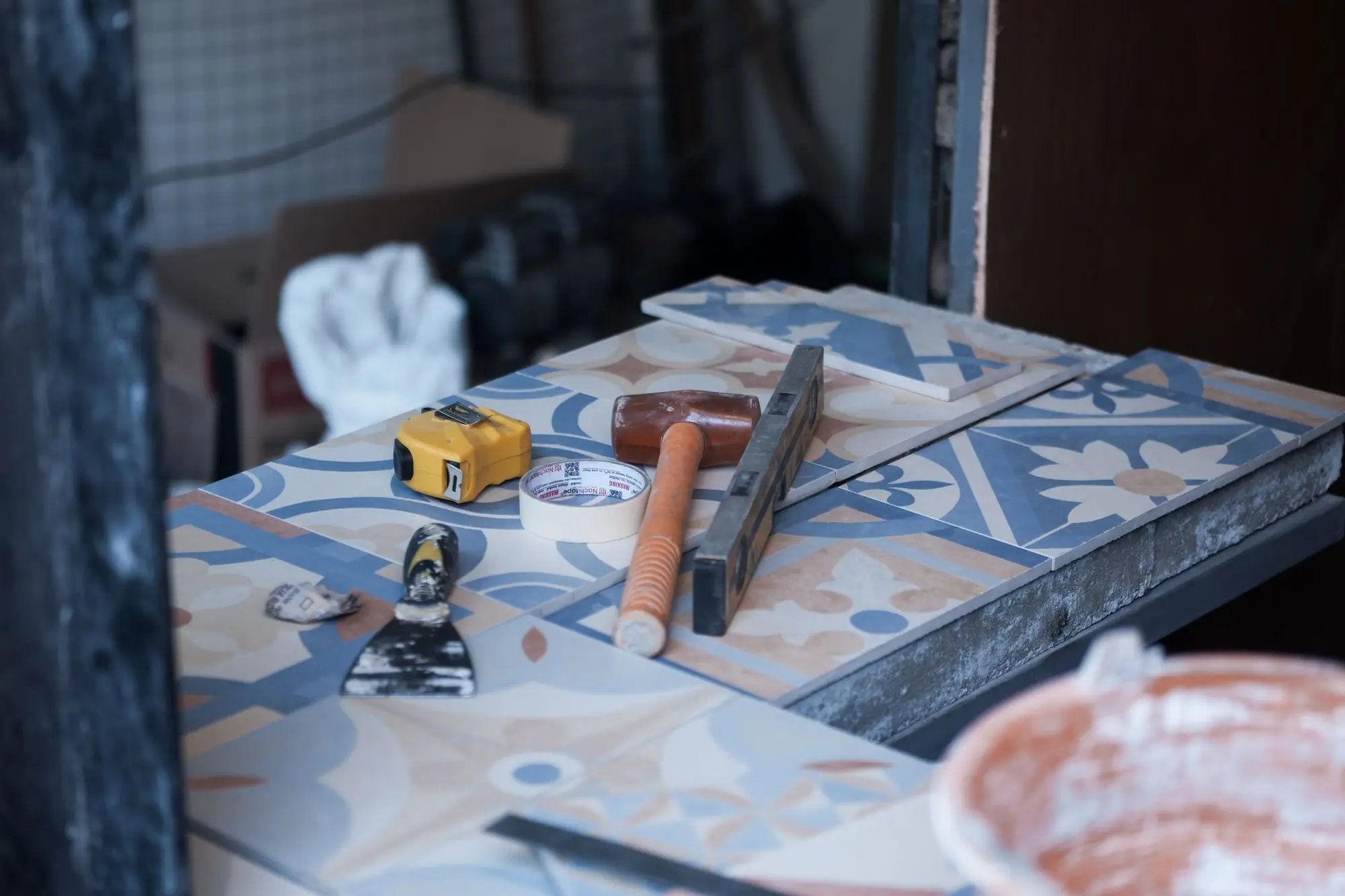 Tile, spacers and tools laid out on site before setting