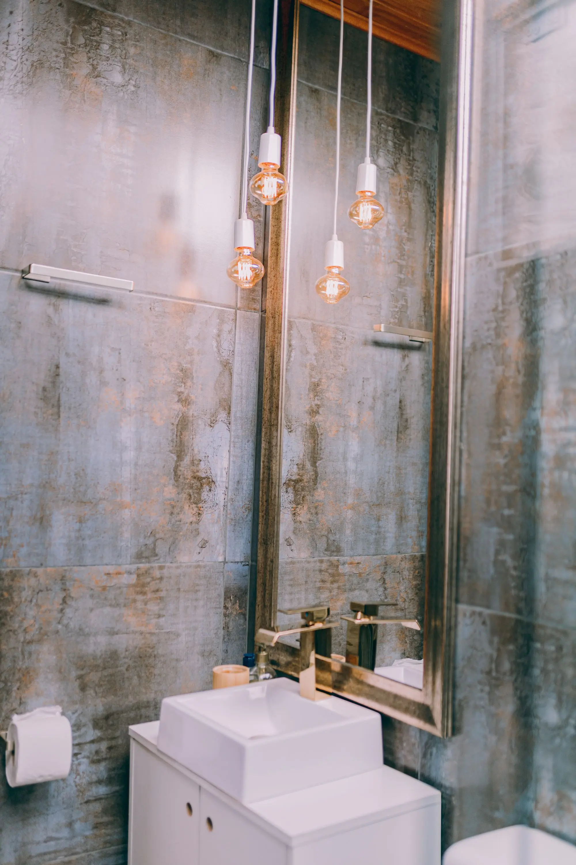Bathroom with a large mirror and a contemporary vanity
