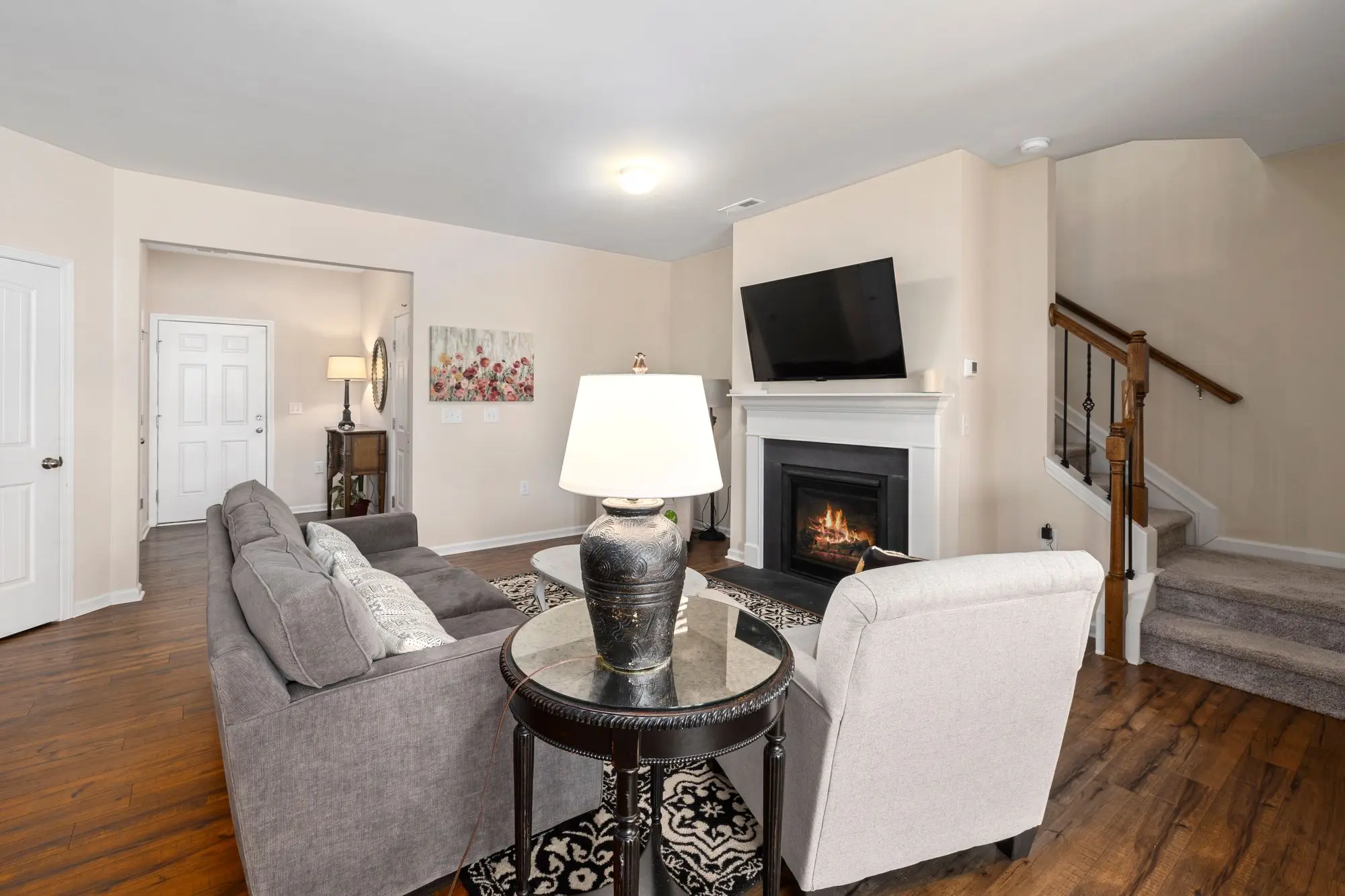 Renovated living room with a fireplace and modern furniture